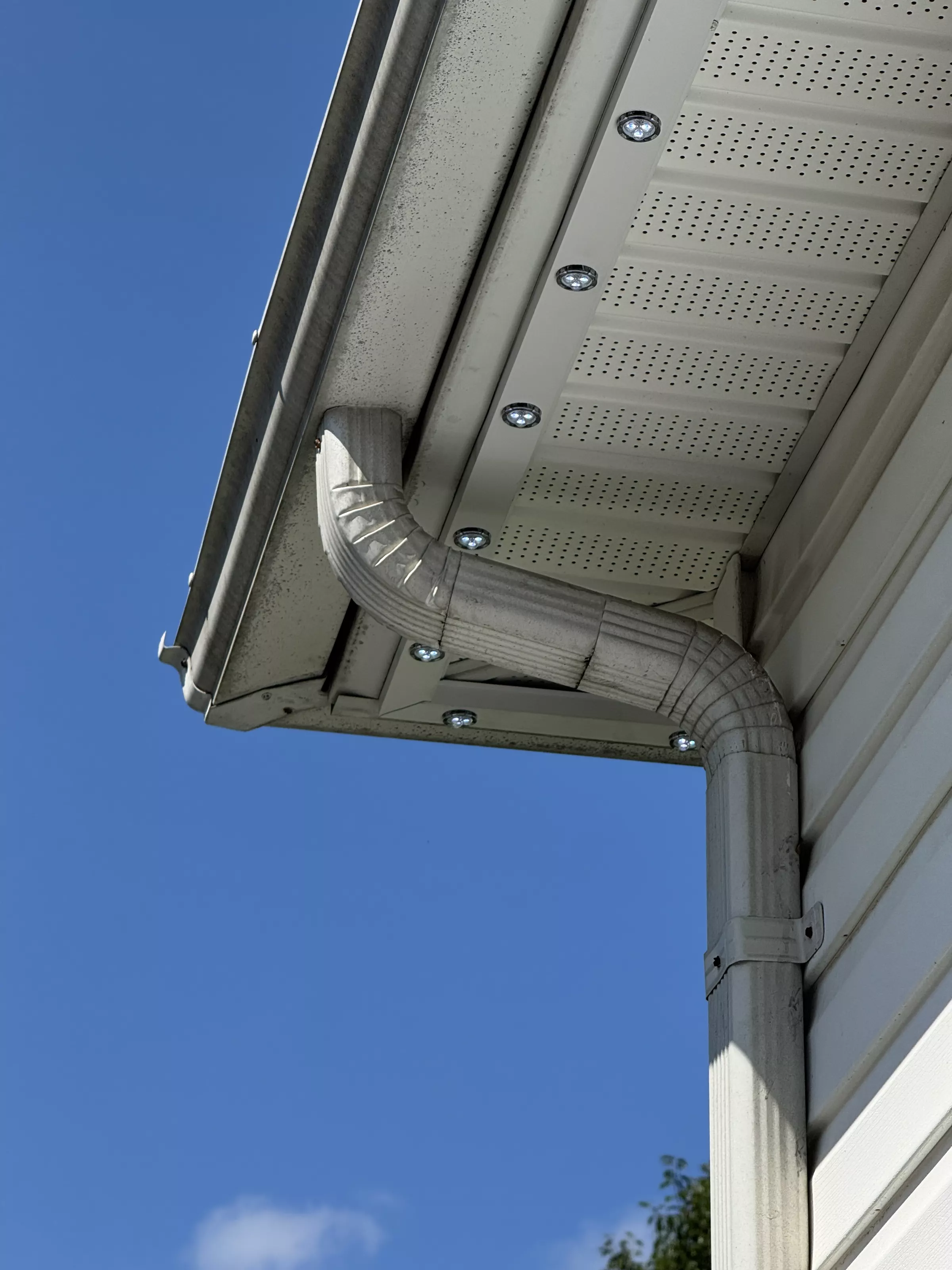 Soffit lights against a blue sky