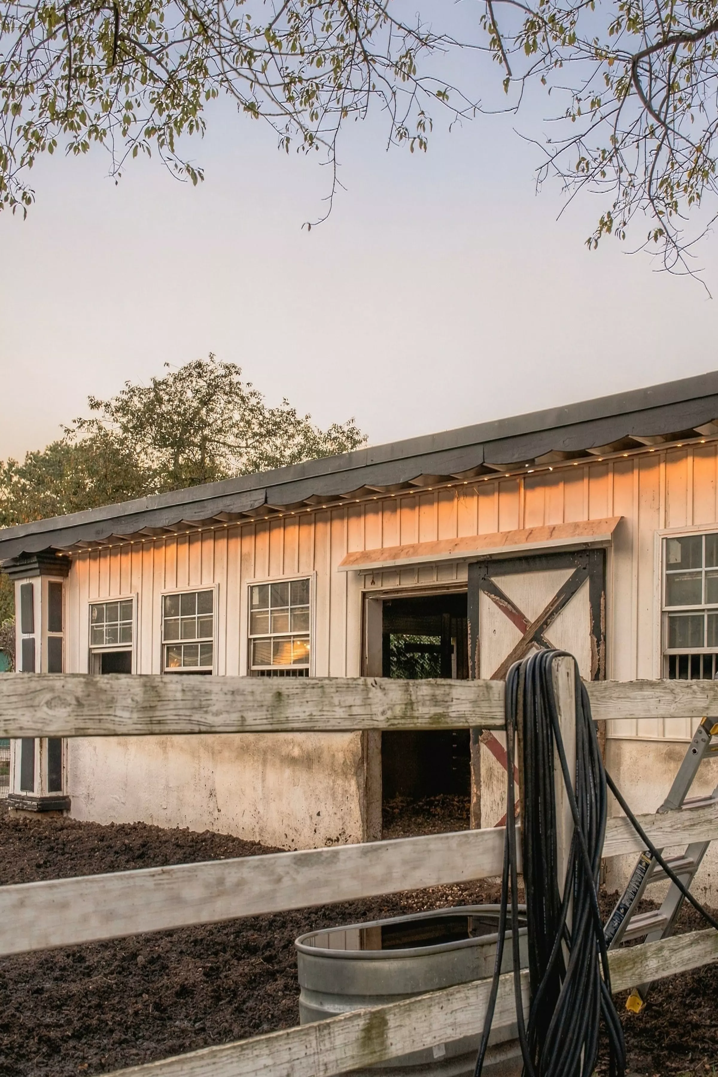 Barn front with warm eave lights
