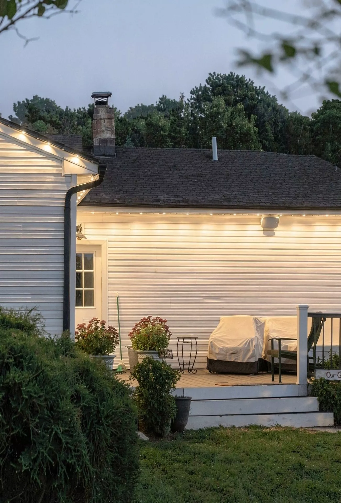 Backyard patio under warm lights