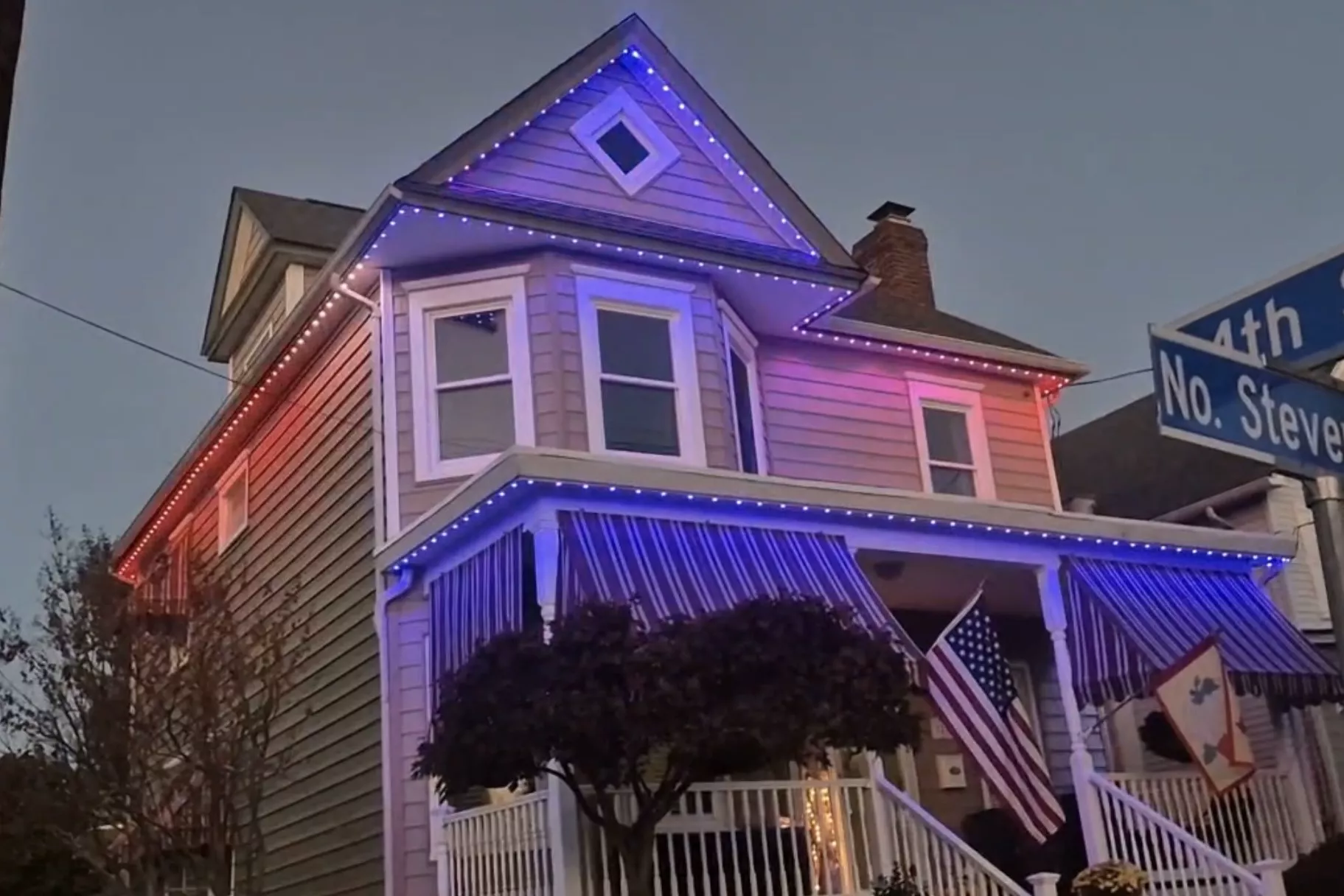 Victorian home in red, white and blue lights