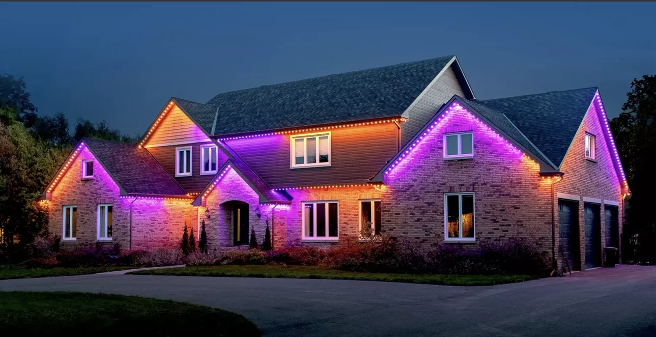 Large home in purple and orange lights